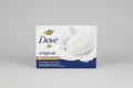 Dove soap bar packaging on a wooden surface with a blue background