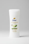 Dove advanced care invisible+ deodorant on a wooden surface with a blue background